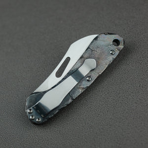 Time honored sculpture-Folding knife with rock texture and titanium alloy handle